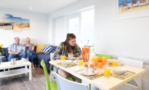 Interior view of new apartment accommodation living room at Beachside Holiday Park, Cornwall