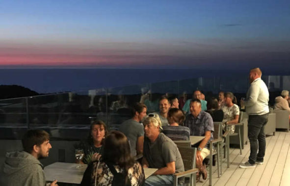 View of sunset from Coast kitchen-bar-terrace at Beachside Holiday Park